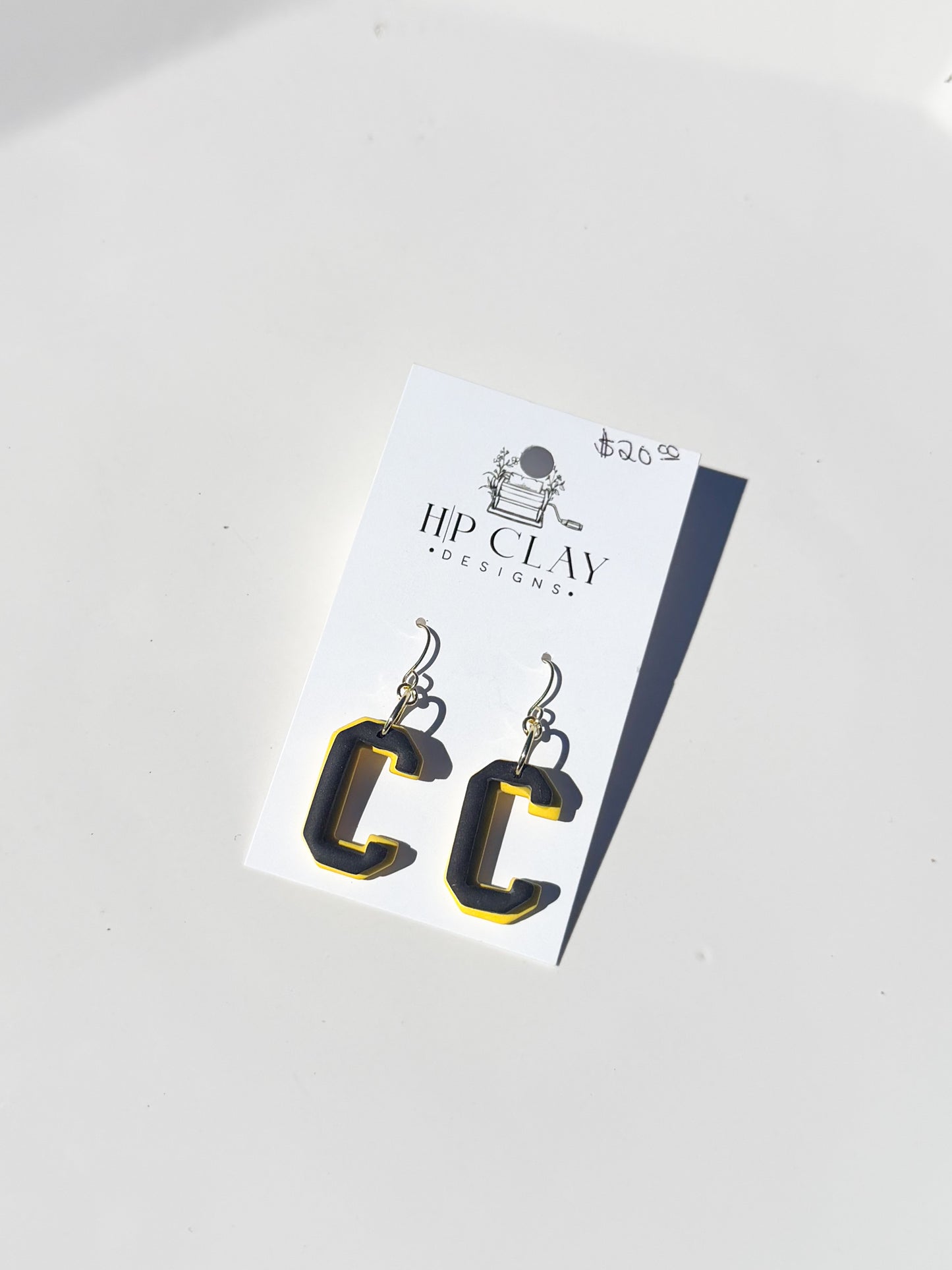 C Dangle ( Yellow backing, Black outline)