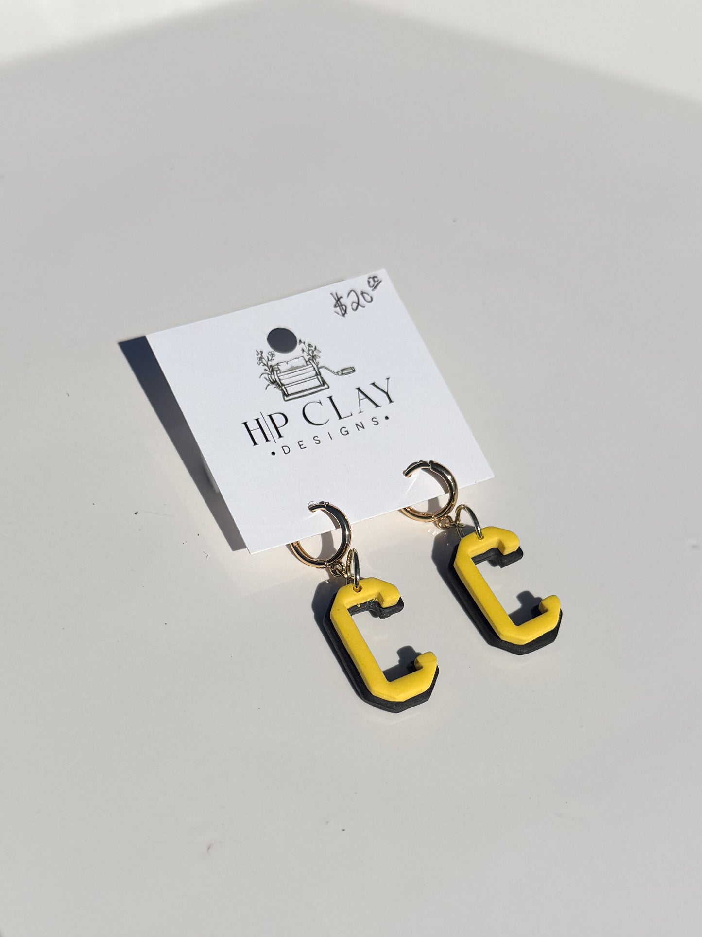 C Huggie ( Black backing, Yellow outline)
