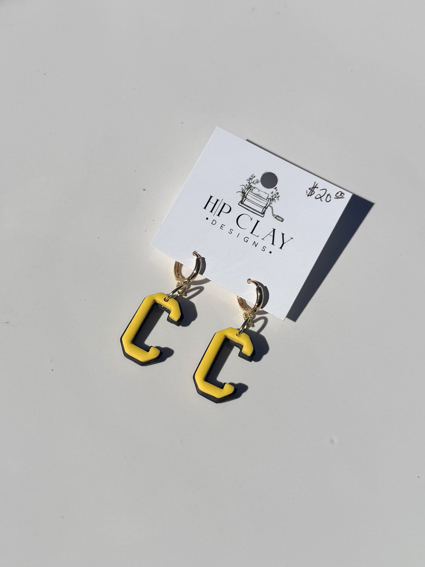 C Huggie ( Black backing, Yellow outline)