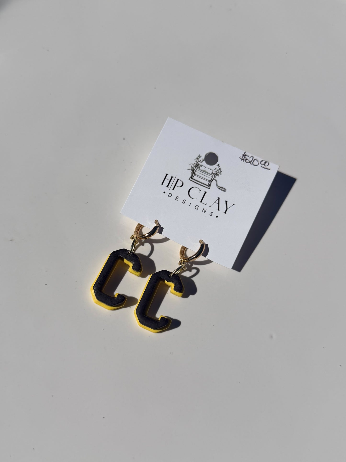 C Huggie (Yellow backing, Black outline)