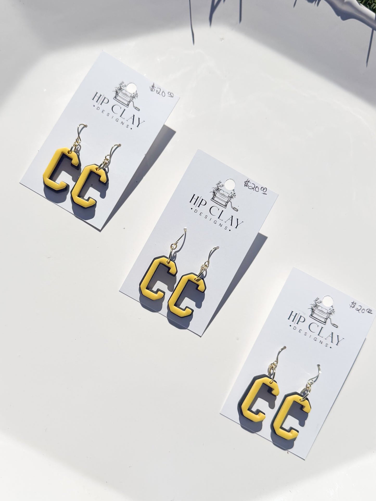 C Dangle ( Black backing, Yellow outline)